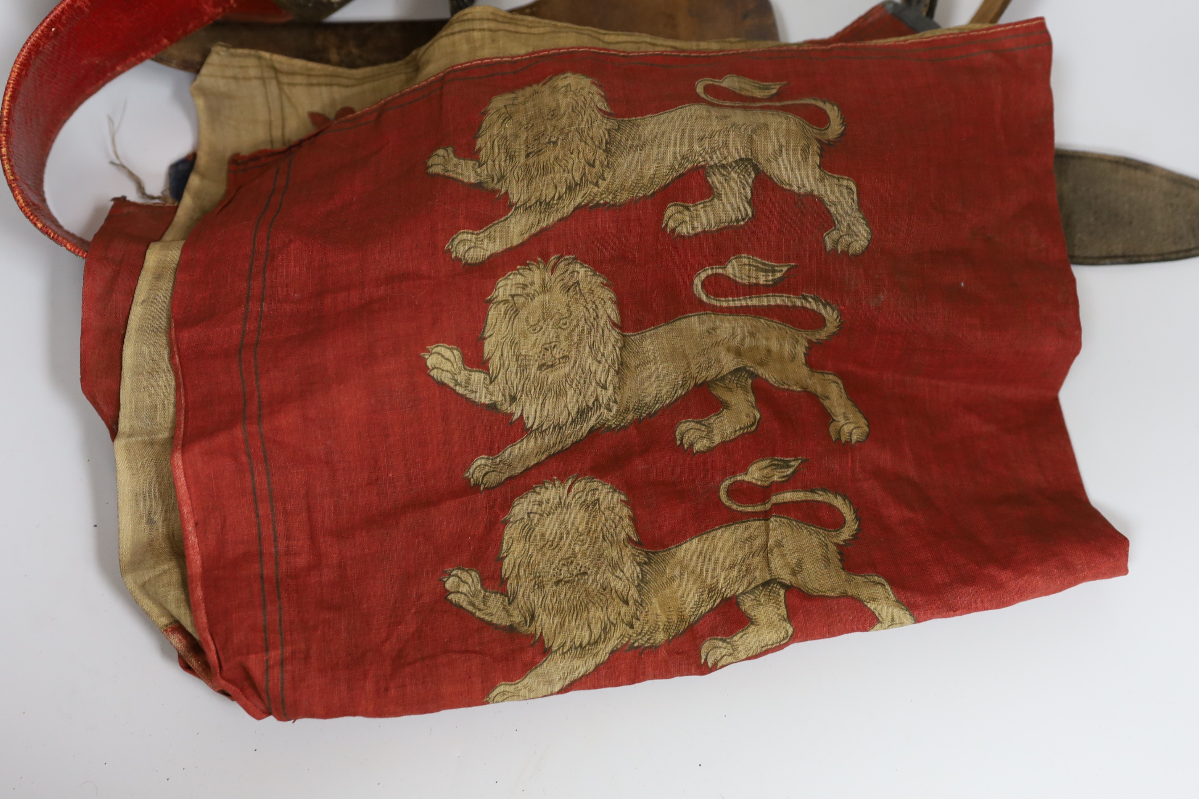 A Royal Naval gilt brass mounted officers belt, an Edwardian Dieu et mon droit belt, a Victorian printed flag and A Victorian Yorkshire Regiment officers brocade sword belt